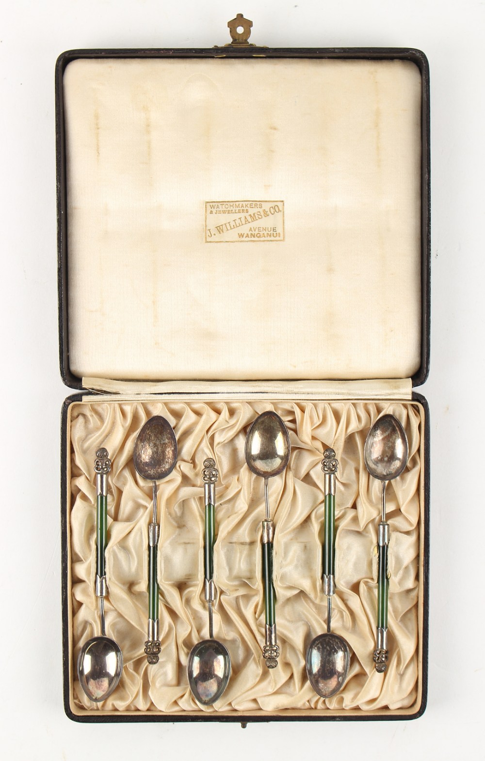 Property of a lady - an ealy 20th century cased set of six Maori white metal & nephrite jade