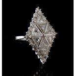 Property of a gentleman - an 18ct white gold diamond ring set with eight triangular cut diamonds, in