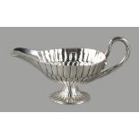 Property of a lady - a Sanborns Sterling silver sauceboat, of fluted pedestal form, the ropetwist