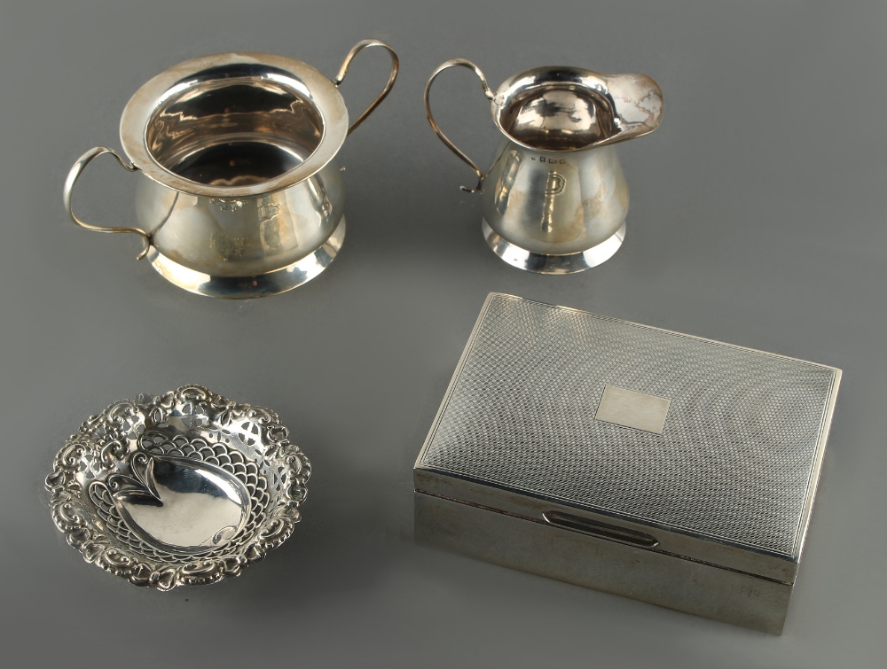 Property of a lady - an Edwardian silver cream jug and matching sugar basin, Birmingham 1909/10;