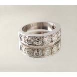 Property of a gentleman - an unmarked platinum eight stone diamond half eternity ring, the eight
