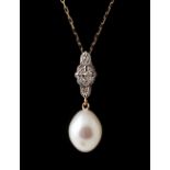 An 18ct yellow gold pearl & diamond pendant necklace, the ovoid shaped pearl measuring approximately