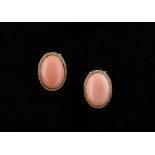 A pair of yellow gold & pink coral earrings, the oval coral panels each approximately 17 by 12.