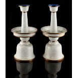 Property of a lady - a pair of Chinese cloisonne temple candlesticks, early 20th century, with white