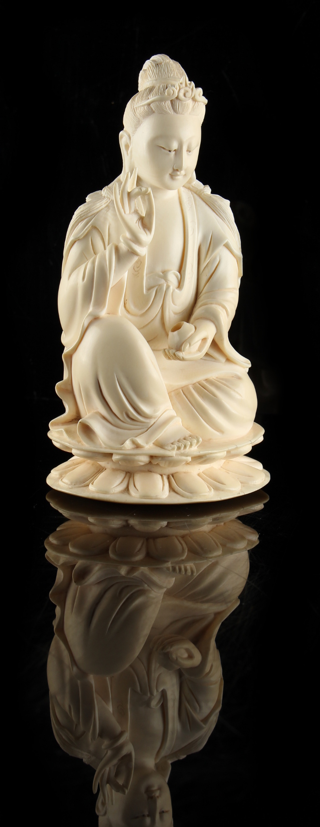 A Chinese carved ivory figure of Guanyin, 19th century, modelled seated on a double lotus base, - Image 2 of 3