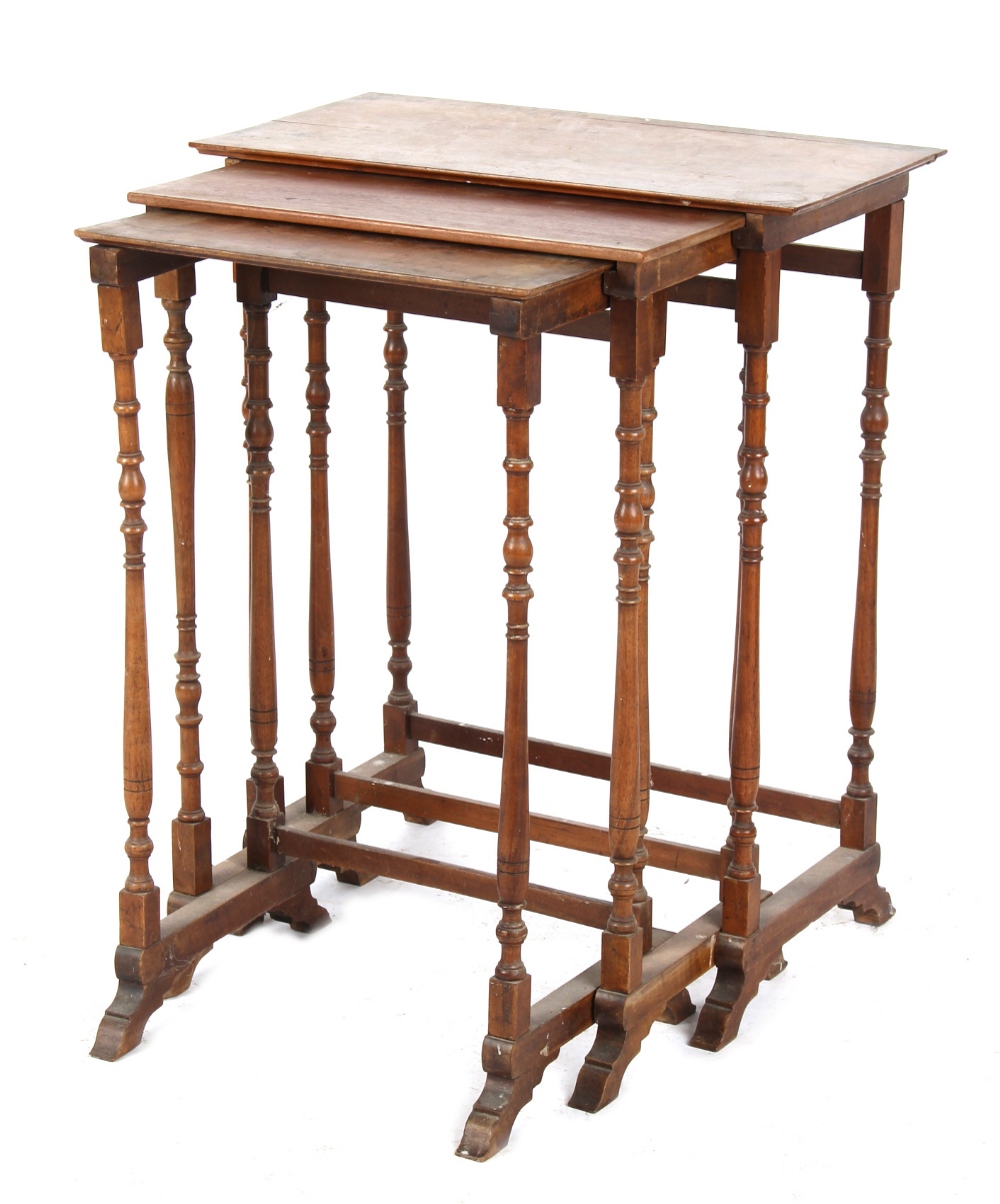 Property of a lady of title - a nest of three rectangular topped occasional tables with turned