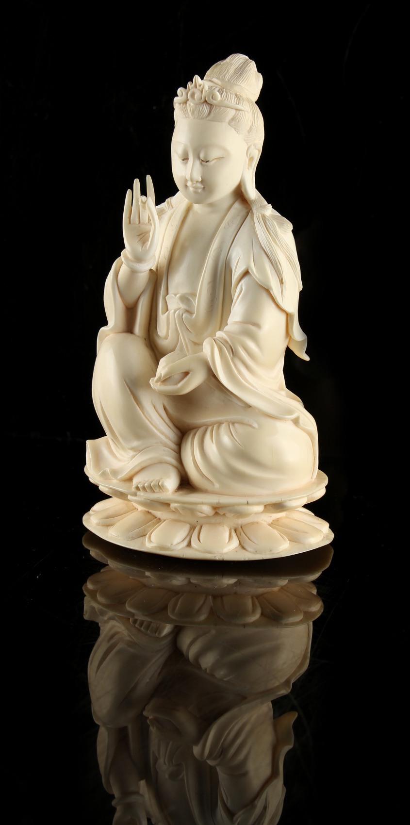 A Chinese carved ivory figure of Guanyin, 19th century, modelled seated on a double lotus base, - Image 3 of 3