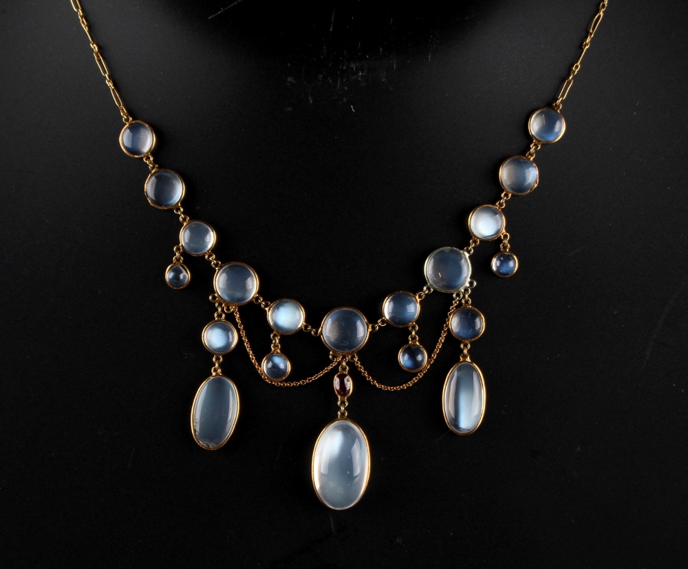 An unmarked yellow gold moonstone & ruby festoon necklace, 16ins. (40.5cms.) long (see - Image 2 of 2
