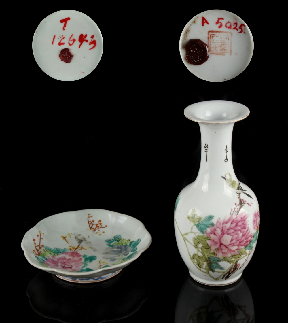 A Chinese famille rose bottle vase depicting a bird among peonies, 20th century, 8.6ins. (21. - Image 2 of 2