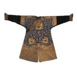 A Chinese blue silk dragon robe, late 19th / early 20th century, worked in couched gold threads with
