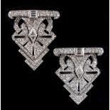A good pair of Art Deco style platinum diamond clips, with triangular cut, baguette & round