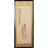 A Chinese painting on paper depicting a standing monk, early 20th century, with calligraphy & red