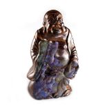 Property of a gentleman - a Chinese carved opal figure of Budai, modelled standing & holding a