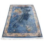 Property of a gentleman - a Chinese hand knotted wool carpet, late 20th century, with blue ground,