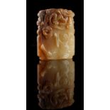 A Chinese carved jade rectangular plaque, carved to one side with a boy & bird, the reverse with