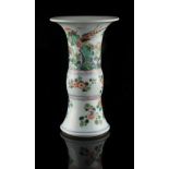 A Chinese famille verte gu vase, Kangxi period (1662-1722), painted with a bird & butterflies