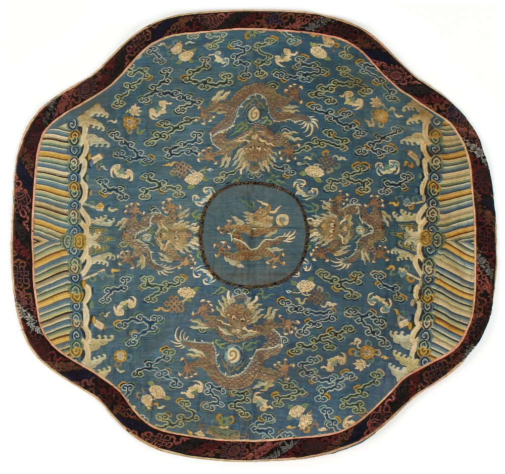 A 19th century Chinese kesi dragon quatrefoil panel, with a central dragon within a pale blue ground