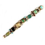 A multi gem set panel bracelet, including two cameos the stones including malachite & turquoise,