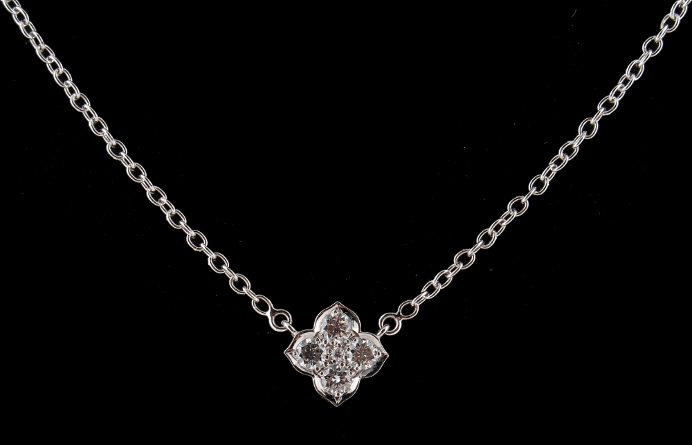 A Cartier 18ct white gold & diamond stylised flowerhead pendant on chain necklace, set with five