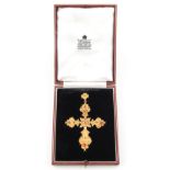 A large unmarked yellow gold ruby & emerald cross or crucifix pendant, 3.5ins. (9cms.) long,