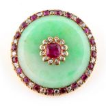 A Chinese jadeite ruby & diamond circular panel brooch, set with a central certificated untreated
