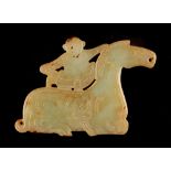 A Chinese carved archaistic yellow jade pendant modelled as a boy on a recumbent horse, 3.55ins. (