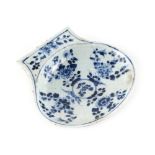 A Chinese blue & white scallop shell shaped dish, 17th / 18th century, 6.4ins. (16.2cms.) wide (