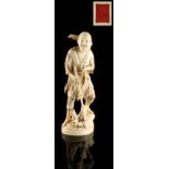 Property of a lady - a Japanese carved ivory okimono depicting a fisherman harpoonist, loss to top