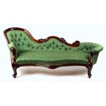 Property of a gentleman - a Victorian style carved frame chaise longue, with green floral button