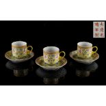 A set of three Chinese famille rose yellow ground 'Birthday' cups & saucers, iron red Guangxu 6-