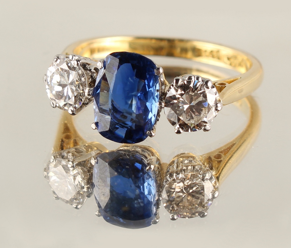 An 18ct yellow gold sapphire & diamond three stone ring, the central cushion cut sapphire weighing - Image 2 of 2