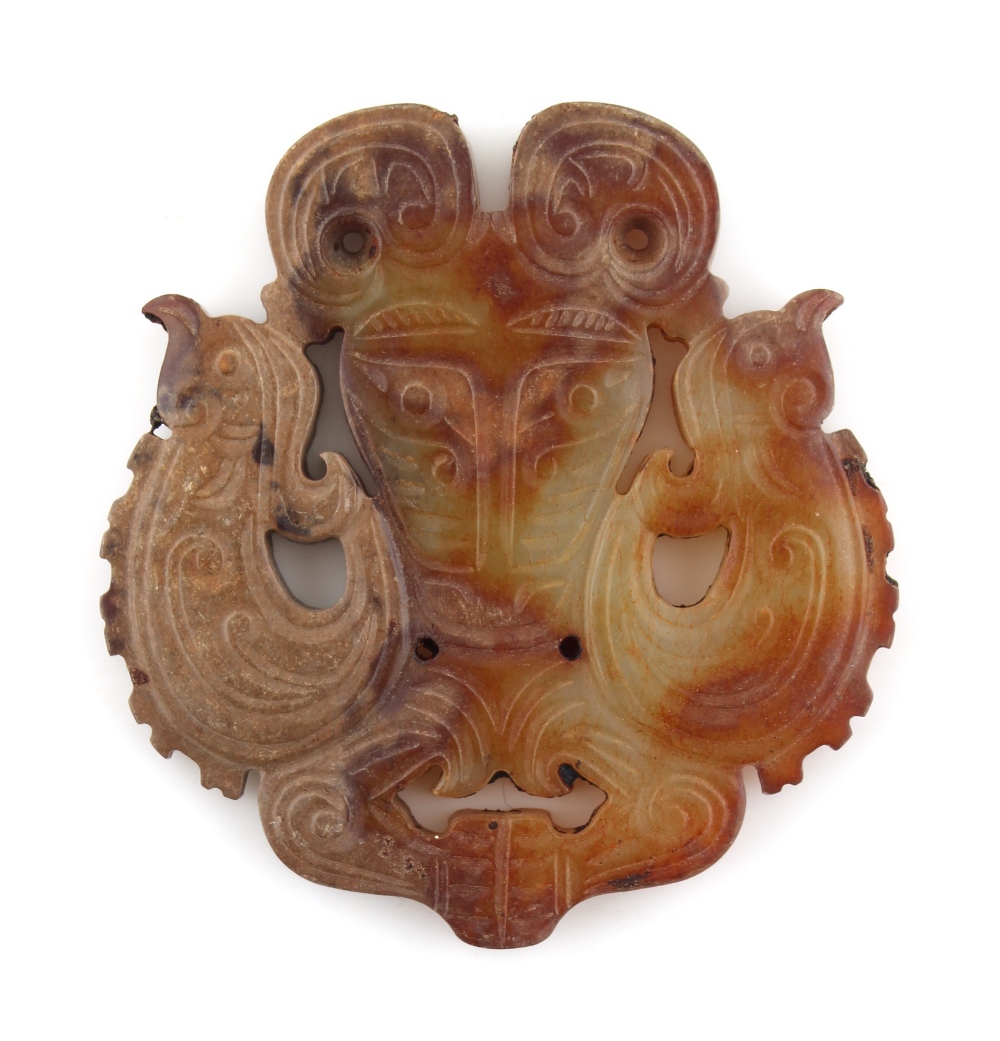A Chinese carved jade pendant or plaque modelled as two birds, 2.55ins. (6.5cms.) high (see