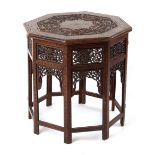 Property of a gentleman - an Indian carved teak & brass inlaid octagonal folding table, 23ins. (58.