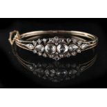 An early / mid Victorian unmarked yellow gold & rose cut diamond hinged bangle, the estimated