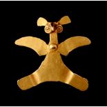 Property of a gentleman - a Chiriqui (Panama) gold (tests 15ct) pendant modelled as a bird, probably