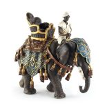 Property of a lady - a cold painted bronze model of a caparisoned elephant with howdah & rider,