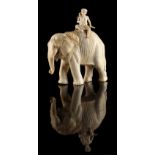 Property of a gentleman - a Japanese carved ivory okimono modelled as a standing elephant with