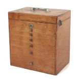 Property of a gentleman - an early 20th century dentist's table top cabinet of drawers, with