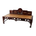 A late 19th century Chinese carved hongmu & cane panelled day bed, with dream stone or Dali marble