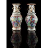 Property of a lady - a pair of 19th century Chinese Canton famille rose baluster vases, painted with