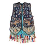 A good Chinese navy blue silk sleeveless jacket, late 19th / early 20th century, decorated in gilt