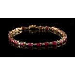 Property of a lady - a 14ct gold gem set bracelet, 7.5ins. (19cms.) long. approximately 8.0 grams.