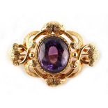 Property of a deceased estate - a good Victorian unmarked yellow gold amethyst brooch, the oval