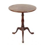 Property of a lady - a George III mahogany circular tilt-top occasional table with turned column &