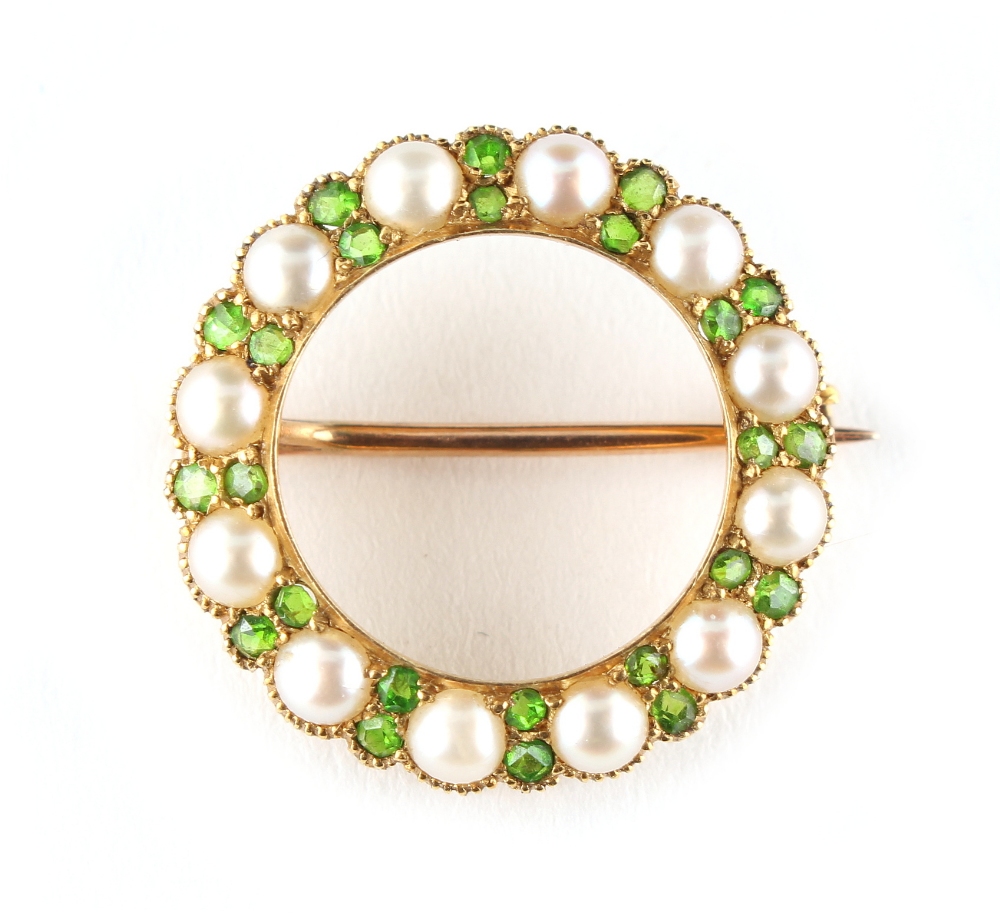 A late Victorian unmarked yellow gold demantoid garnet & seed pearl circular hoop brooch, - Image 2 of 2