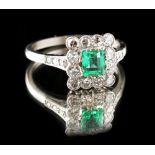 A 14ct white gold emerald & diamond ring, the rectangular cut emerald weighing approximately 0.42