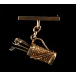 Property of a deceased estate - a 9ct gold bar brooch with 9ct gold pendant modelled as a golf bag