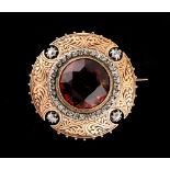 A Madeira citrine & diamond circular brooch, the round cut citrine measuring approximately 17mm