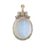 A good 19th century Italian diamond & carved rock crystal oval cameo pendant depicting a standing