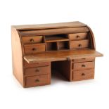 Property of a gentleman - a miniature or apprentice roll top desk, with pull-out slide